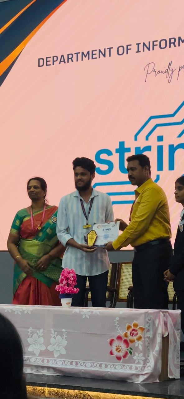 Receiving first prize at competitive programming contest at Dhanalaksmi College of Engineering